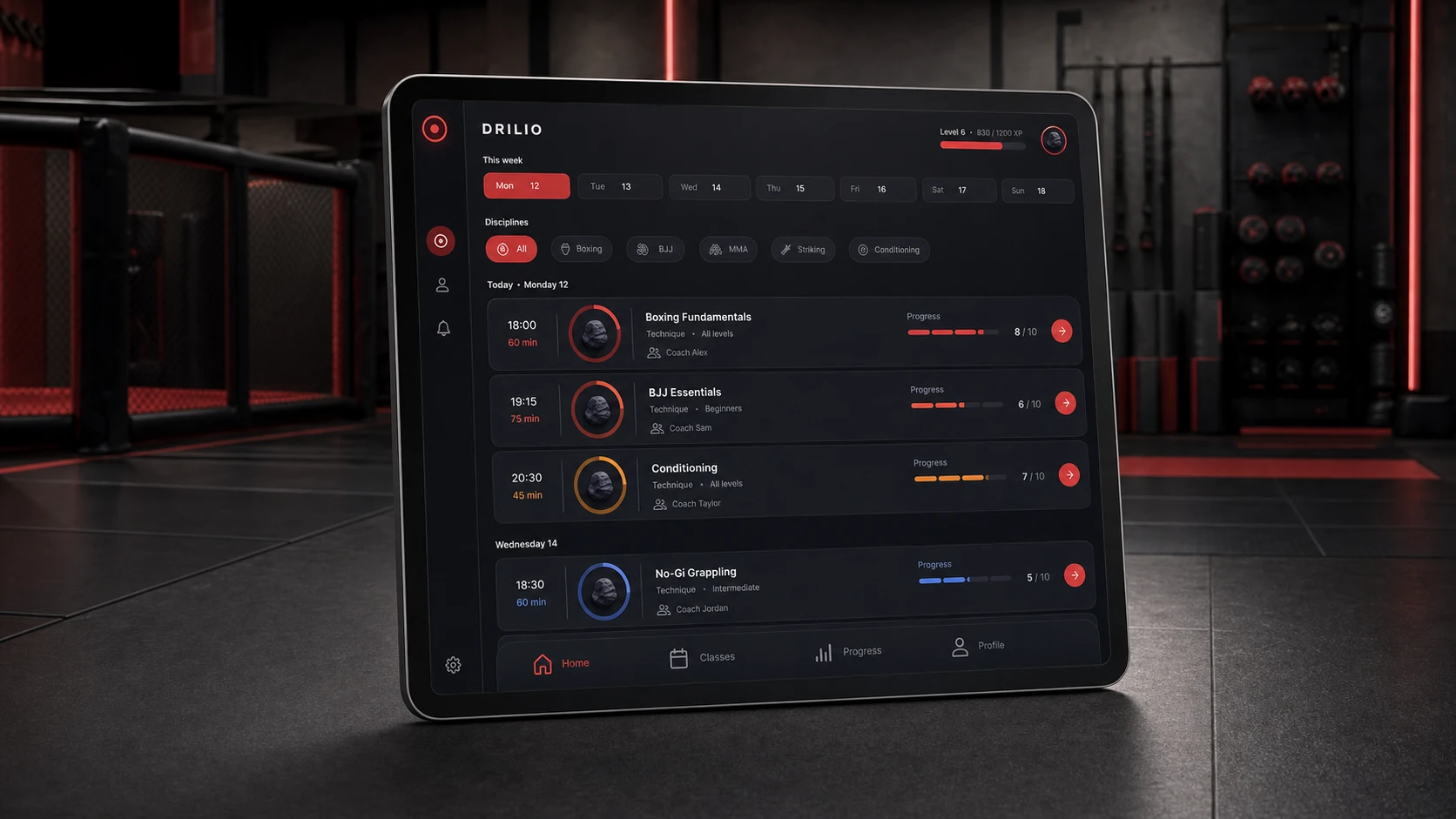 Programme d’entraînement DRILIO affiché dans une tablette au cœur d’une salle de sports de combat